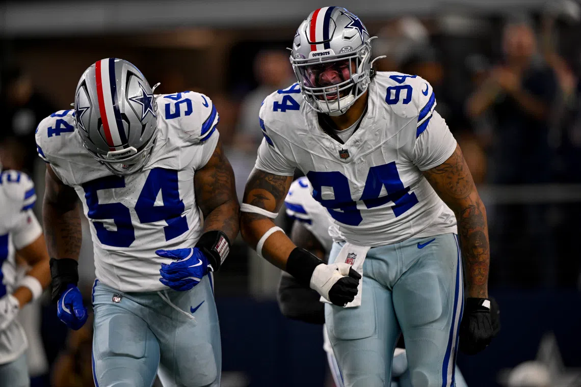 Nov 3, 2025; Arlington, Texas, USA; Dallas Cowboys defensive end Marshawn Kneeland (94) and defensive end Sam Williams (54) celebrates after returning a blocked punt for a touchdown during the game between the Dallas Cowboys and the Arizona Cardinals at AT&T Stadium. Mandatory Credit: Jerome Miron-Imagn Images