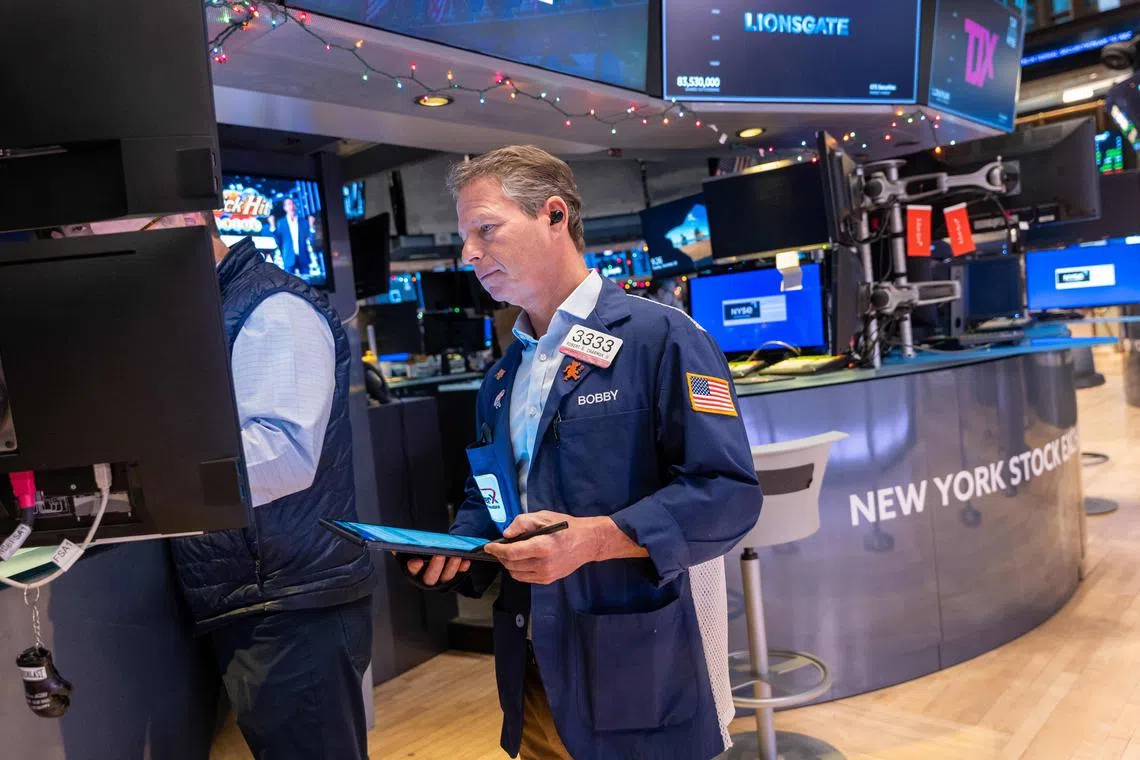 Traders work on the floor of the New York Stock Exchange, on the first day back after the Christmas holiday, on Dec 26, 2023.