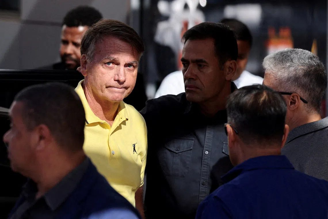 FILE PHOTO: Brazil's former President Jair Bolsonaro arrives at a hospital for medical examinations, authorized by Supreme Court Justice Alexandre de Moraes, leaving the house arrest as he awaits trial after being accused of plotting a coup following his electoral defeat, in Brasilia, Brazil, August 16, 2025. REUTERS/Adriano Machado/File Photo