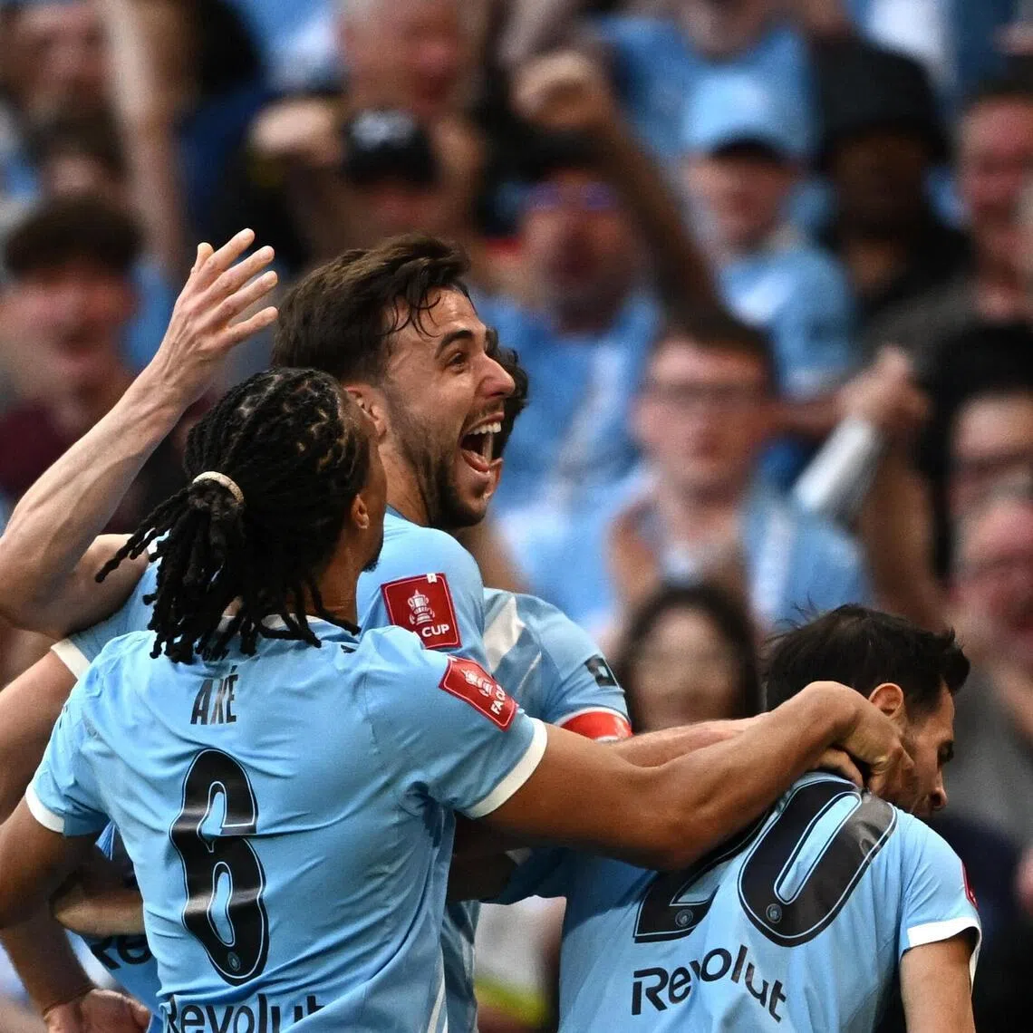 Manchester City's Nico Gonzalez celebrates scoring their second, winning goal in the 87th minute with Bernardo Silva and Nathan Ake.