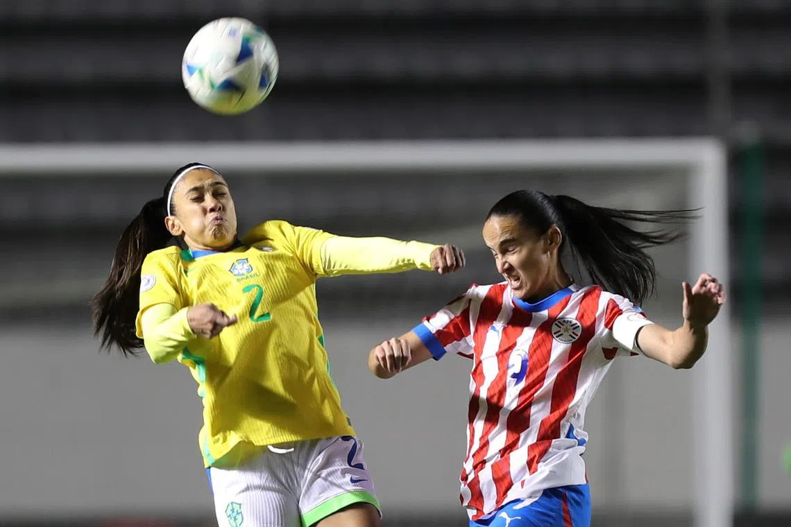 Lice Chamorro (right) of Paraguay vies for the ball with Antônia of Brazil during a Women's America Cup match in Quito, Ecuador on July 22, 2025.