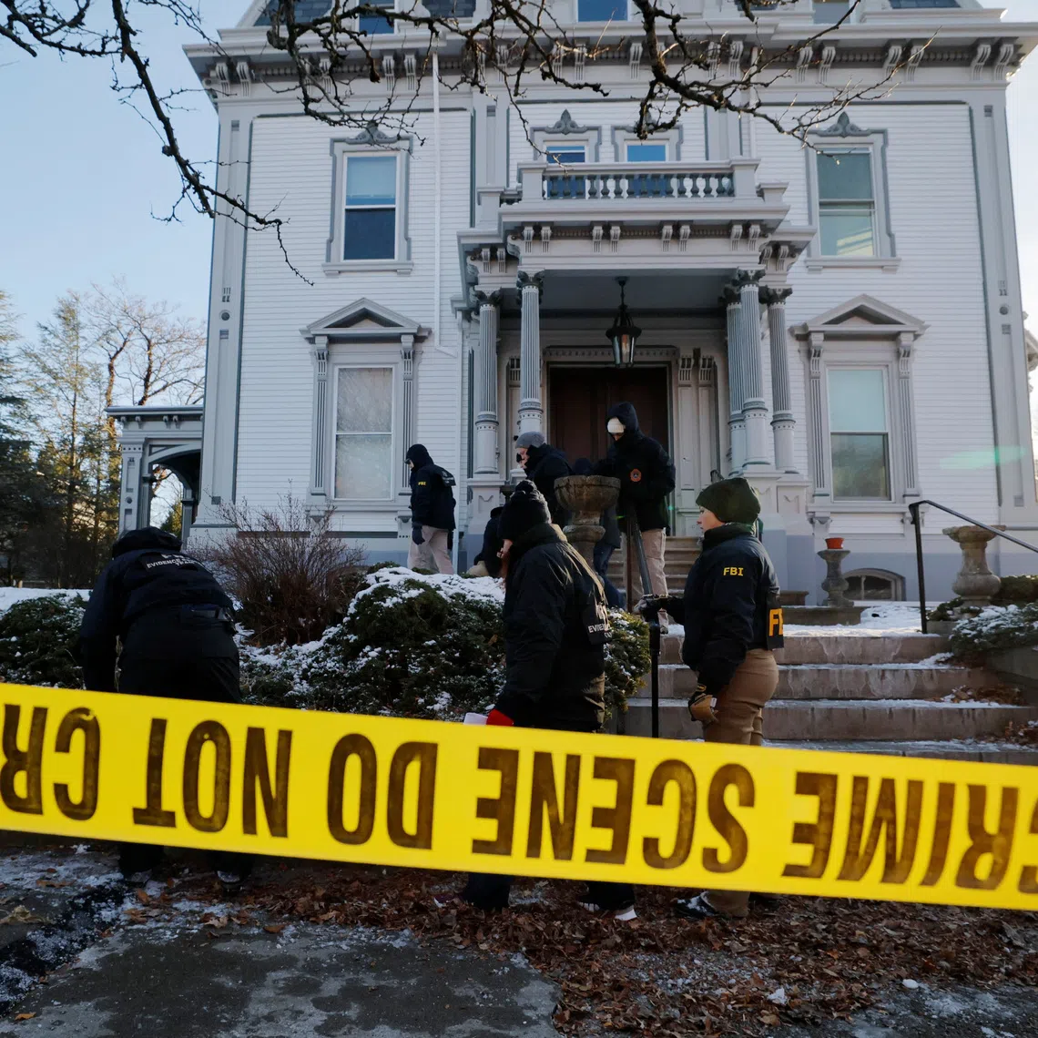 An FBI Evidence Response Team searches the grounds around the site of the Brown University shooting, as the manhunt continues for the gunman, in Providence, Rhode Island, U.S., December 15, 2025.   REUTERS/Brian Snyder
