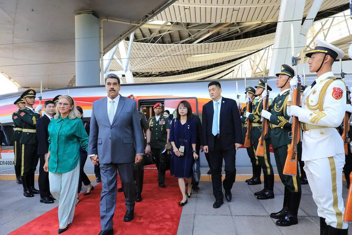 FILE PHOTO: Venezuela's President Nicolas Maduro and his wife Cilia Flores walk together after arriving, in Beijing, China September 12, 2023. Miraflores Palace/Handout via REUTERS