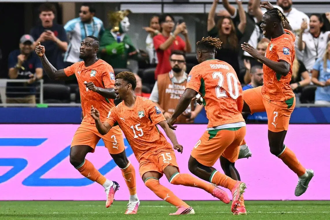 Ivory Coast’s Amad Diallo (second from left) celebrating  after scoring his team’s first goal during their game against Norway on June 30.