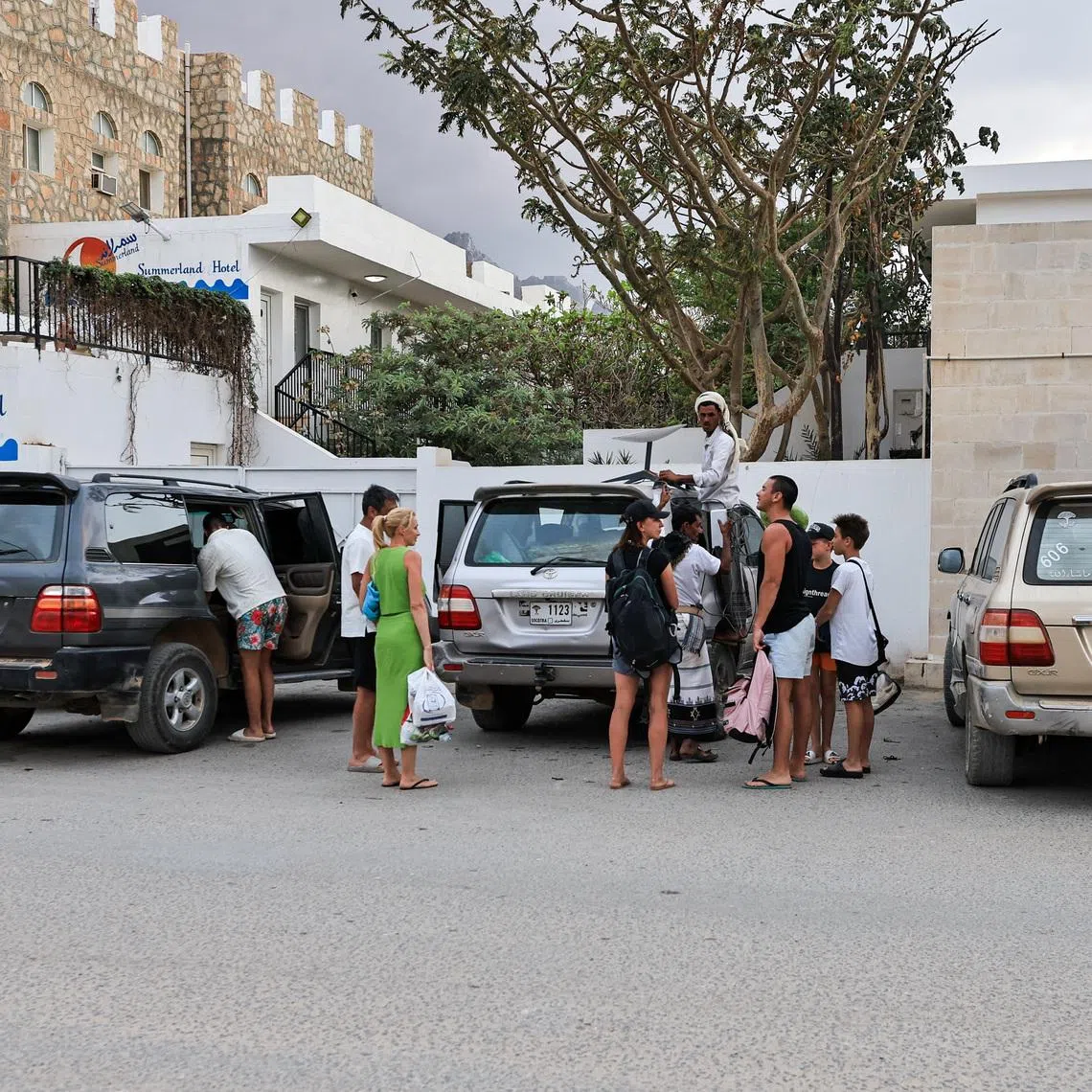 Tourists stand outside a hotel in the Socotra Island, Yemen, January 5, 2026. REUTERS/Stringer