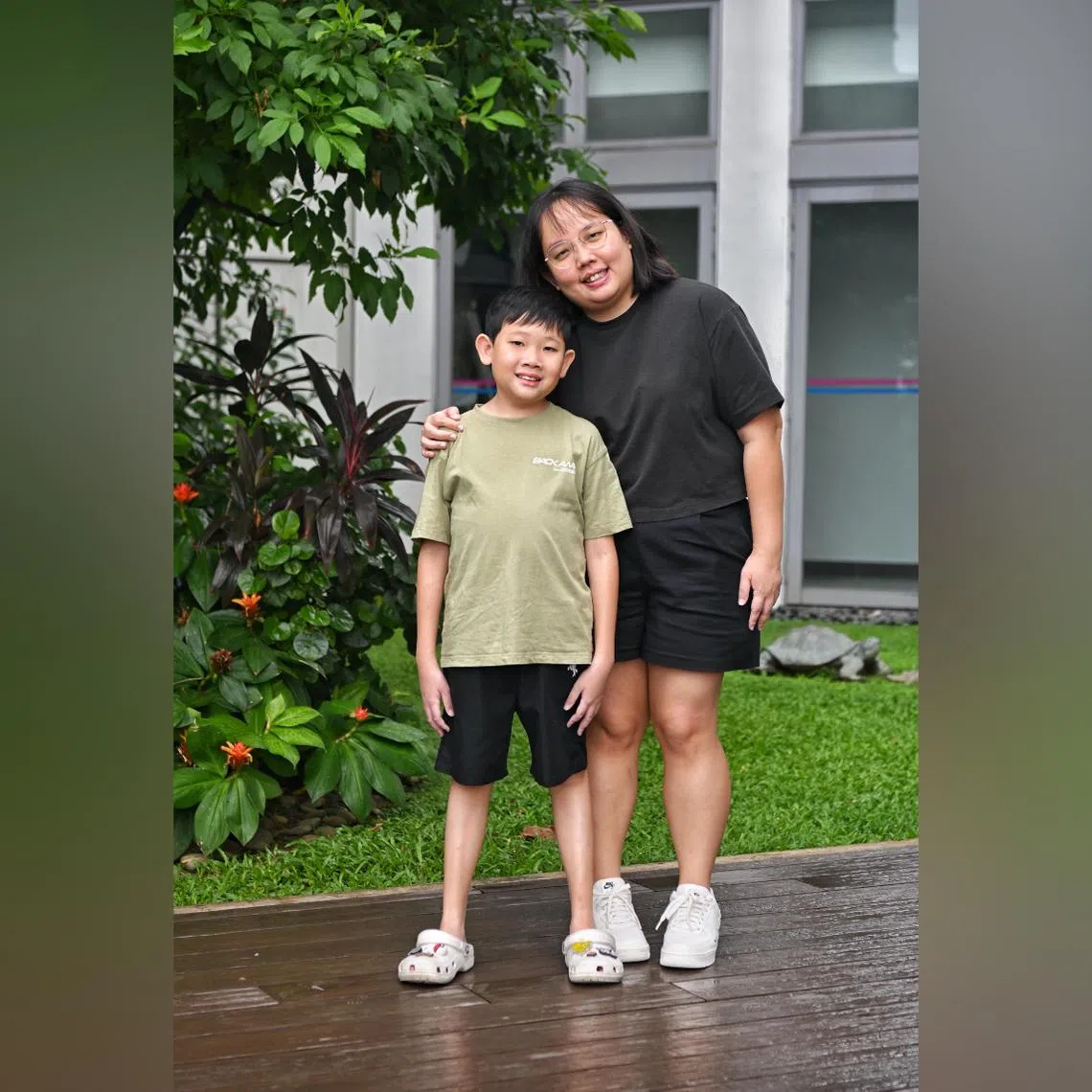 Kayden Soh, 13, who has Glycogen Storage Disorder Type 1A (GSD1A), with his mother, Ms Yong Xiao Ping. GSD1A caused Kayden's body to prioritise essential functions over growth, making him much smaller than his classmates.