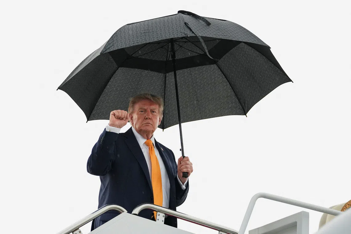 U.S. President Donald Trump makes a fist as he boards Air Force One, en route to Bedminster, New Jersey, at Joint Base Andrews, Maryland, U.S., September, 4, 2026. REUTERS/Eric Lee