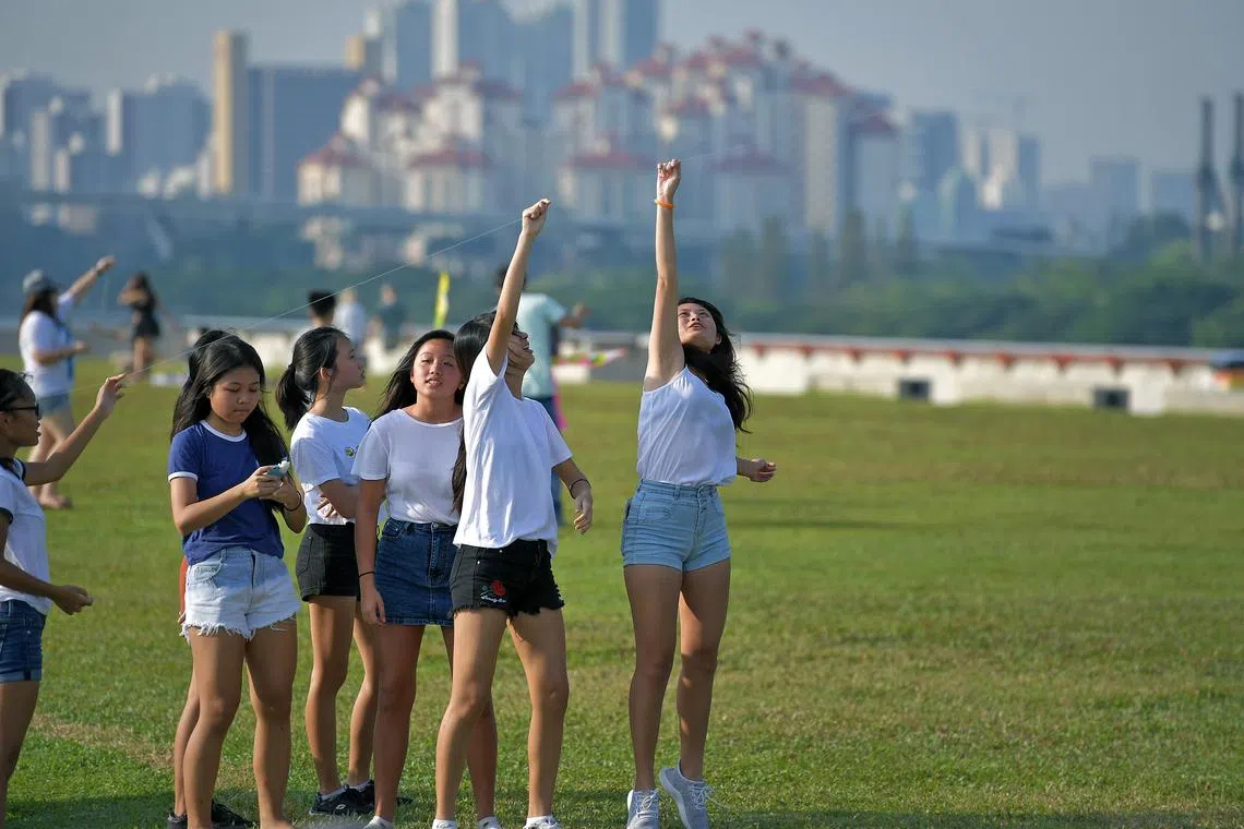 Generic pix of young girls or youth flying kites at the Marina Barrage on Oct 22, 2017.