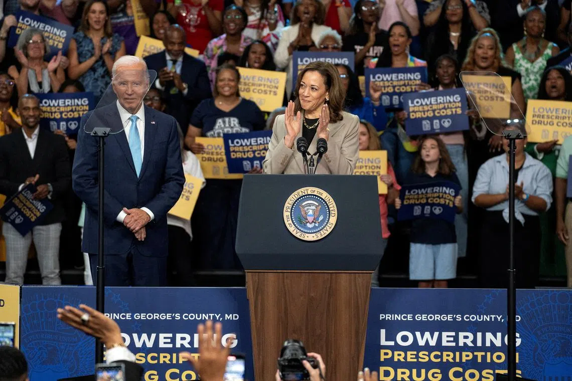 Vice President and Democratic presidential candidate Kamala Harris, delivers remarks as U.S. President Joe Biden looks on at an event on Medicare drug price negotiations, in Prince George's County, Maryland, U.S., August 15, 2024. REUTERS/Ken Cedeno/File Photo