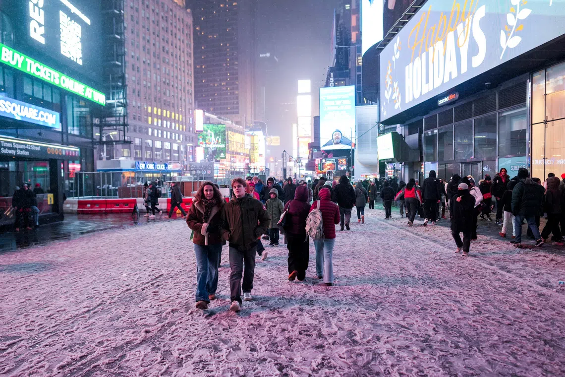 Snow piles up as winter blast moves through New York City area