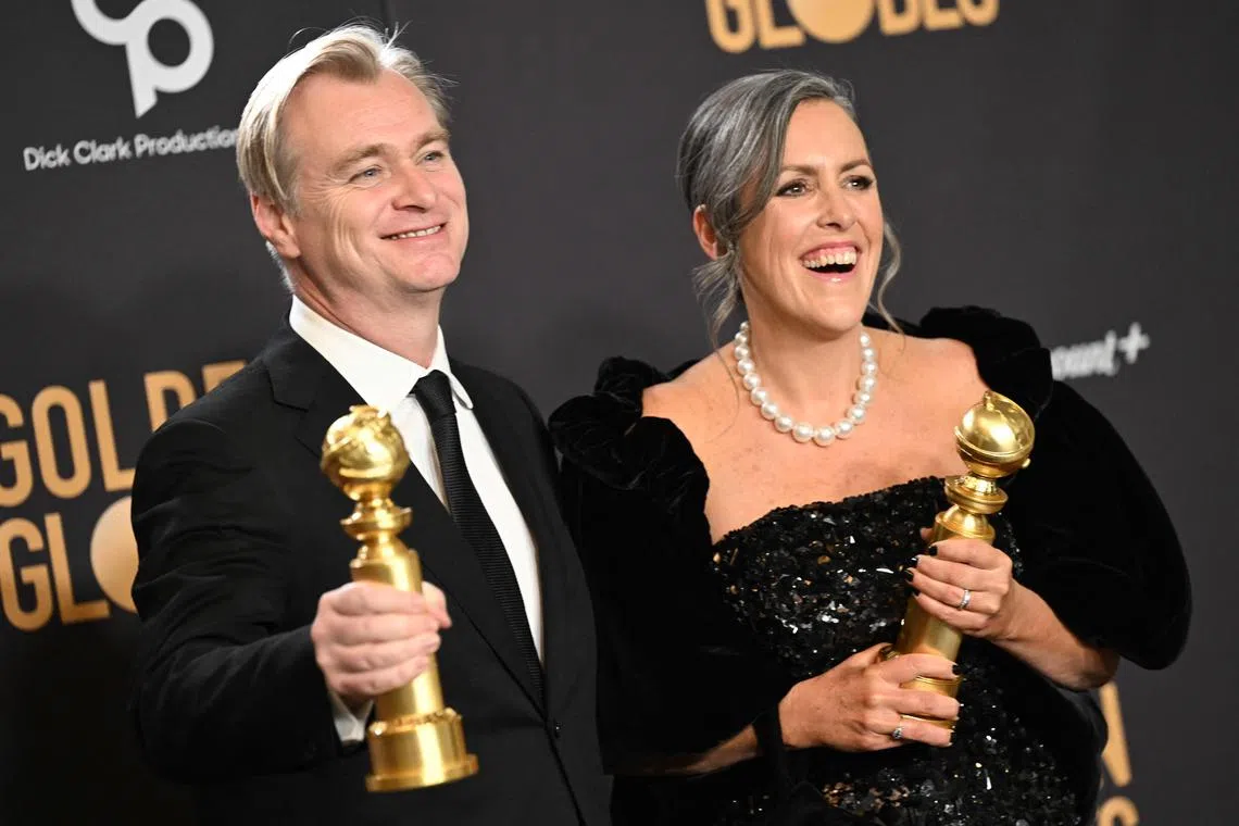 Oppenheimer director Christopher Nolan and film producer Emma Thomas with their Golden Globe awards during the 81st annual Golden Globe Awards ceremony on Jan 7.