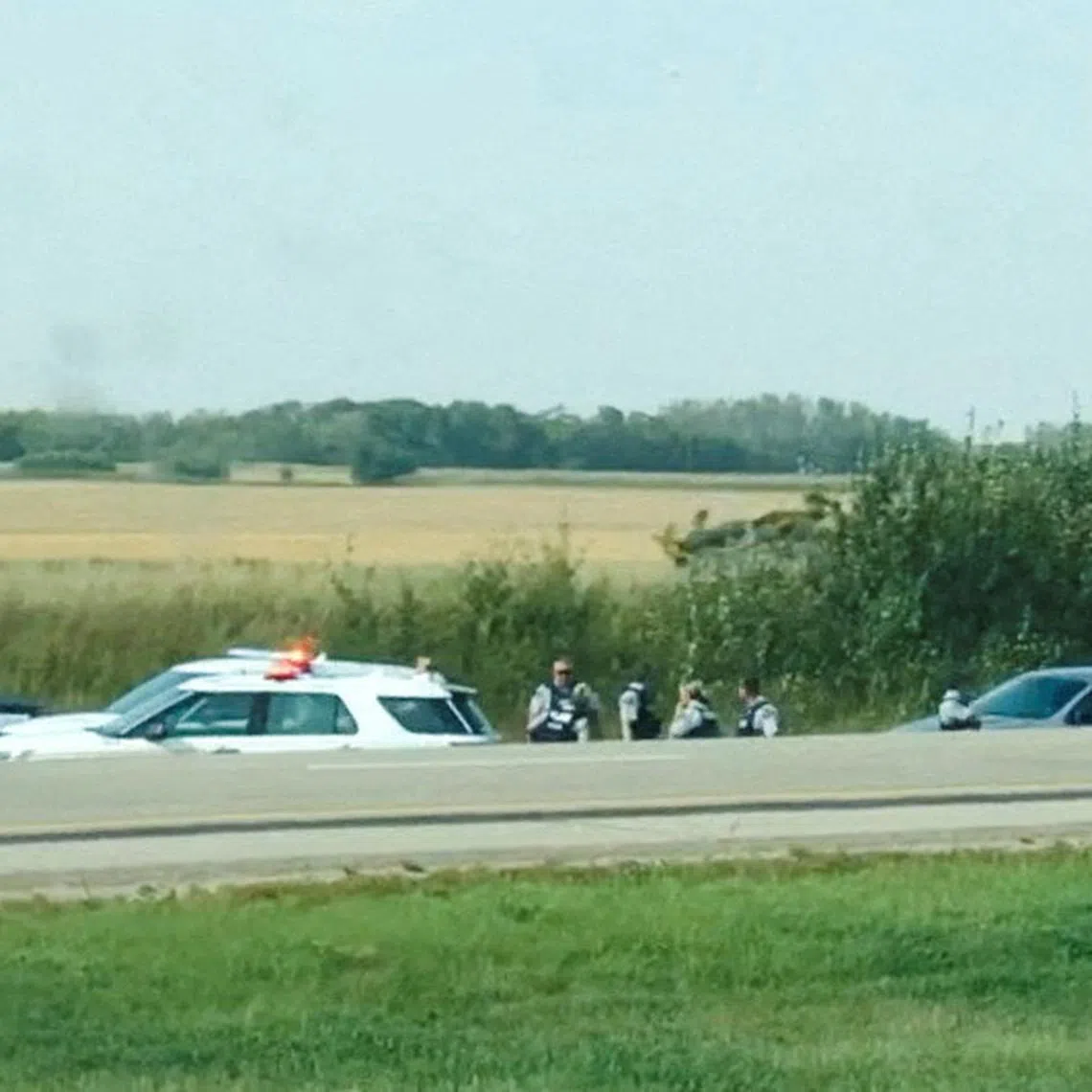 FILE PHOTO: A view of the scene where Myles Sanderson, the suspect of a stabbing spree in the Canadian province of Saskatchewan, is arrested in Rosthern, Saskatchewan, Canada September 7, 2022 in this still image obtained from social media video.  Jordan Brandon/via REUTERS/File Photo