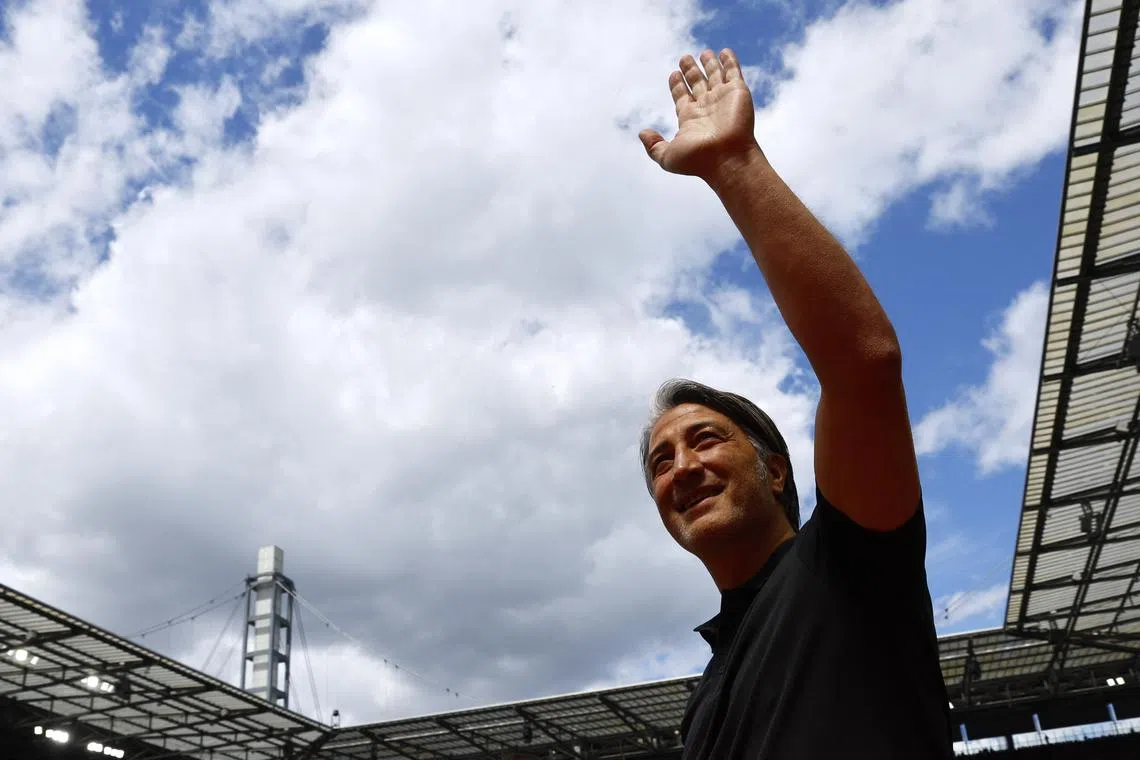 Soccer Football - Euro 2024 - Group A - Hungary v Switzerland - Cologne Stadium, Cologne, Germany - June 15, 2024 Switzerland coach Murat Yakin waves at fans before the match REUTERS/Wolfgang Rattay