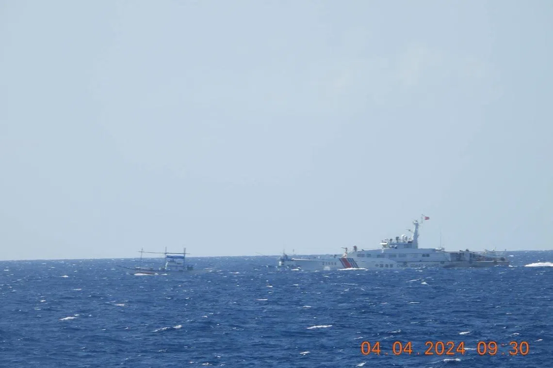 A Chinese coastguard vessel approaches a Filipino fishing vessel in the South China Sea on April 4, 2024, in a handout photo by the Philippine Coast Guard that was released on April 6, 2024. Handout via REUTERS