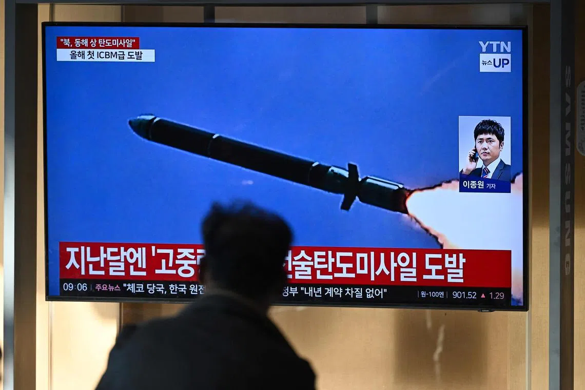 A news broadcasta t a train station in Seoul on Oct 31, with file footage of a North Korean missile test.