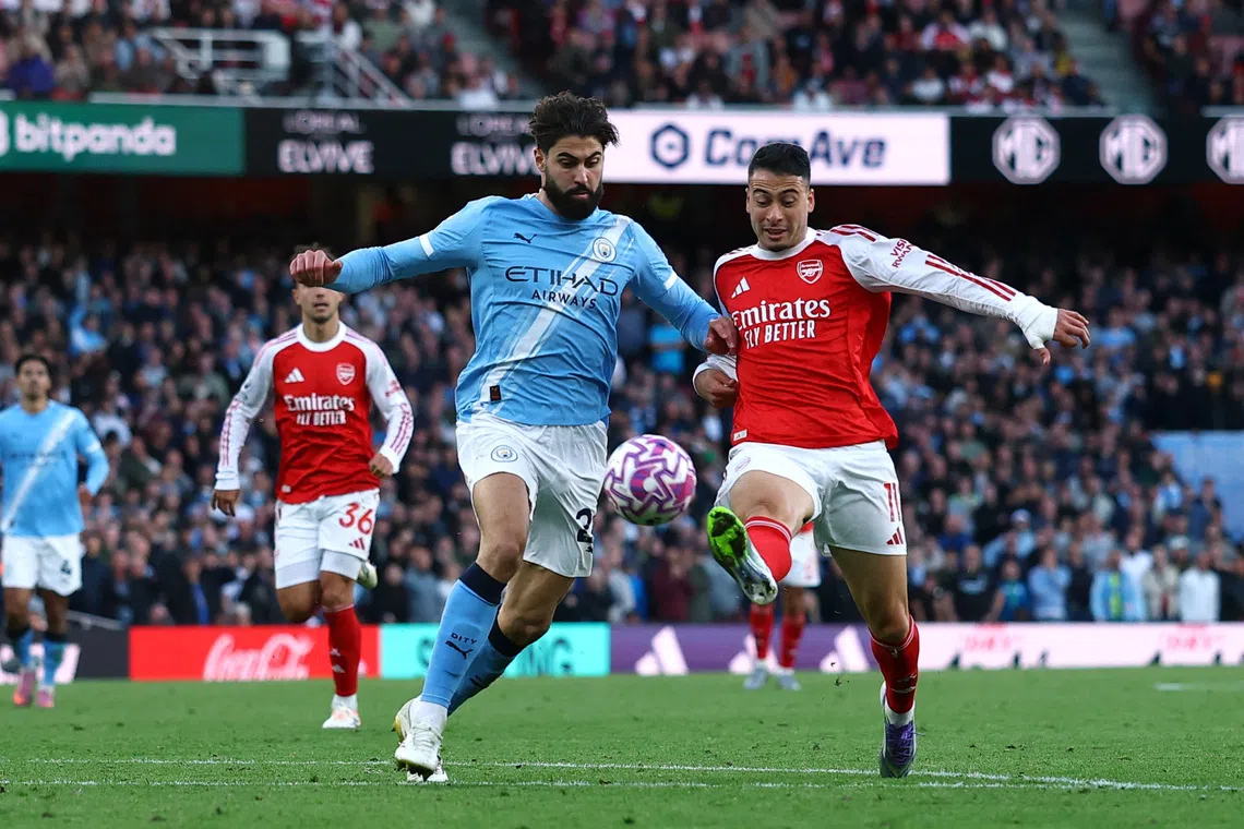 Soccer Football - Premier League - Arsenal v Manchester City - Emirates Stadium, London, Britain - September 21, 2025 Arsenal's Gabriel Martinelli scores their first goal Action Images via Reuters/Matthew Childs EDITORIAL USE ONLY. NO USE WITH UNAUTHORIZED AUDIO, VIDEO, DATA, FIXTURE LISTS, CLUB/LEAGUE LOGOS OR 'LIVE' SERVICES. ONLINE IN-MATCH USE LIMITED TO 120 IMAGES, NO VIDEO EMULATION. NO USE IN BETTING, GAMES OR SINGLE CLUB/LEAGUE/PLAYER PUBLICATIONS. PLEASE CONTACT YOUR ACCOUNT REPRESENTATIVE FOR FURTHER DETAILS..