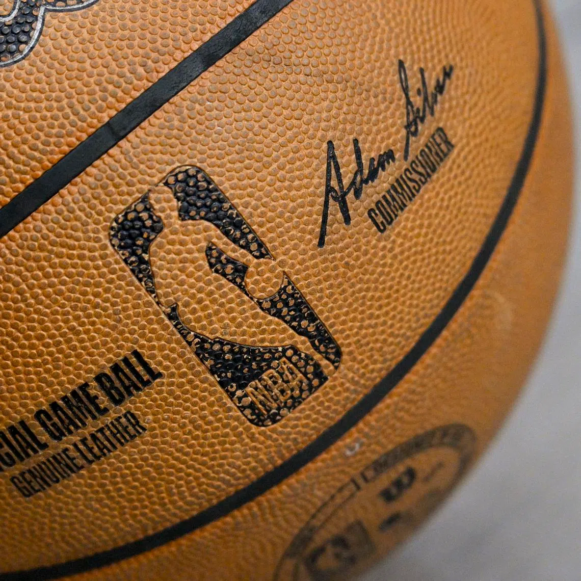 Apr 11, 2025; Dallas, Texas, USA; A view of an NBA basketball and the NBA logo before the game between the Dallas Mavericks and the Toronto Raptors at the American Airlines Center. Mandatory Credit: Jerome Miron-Imagn Images