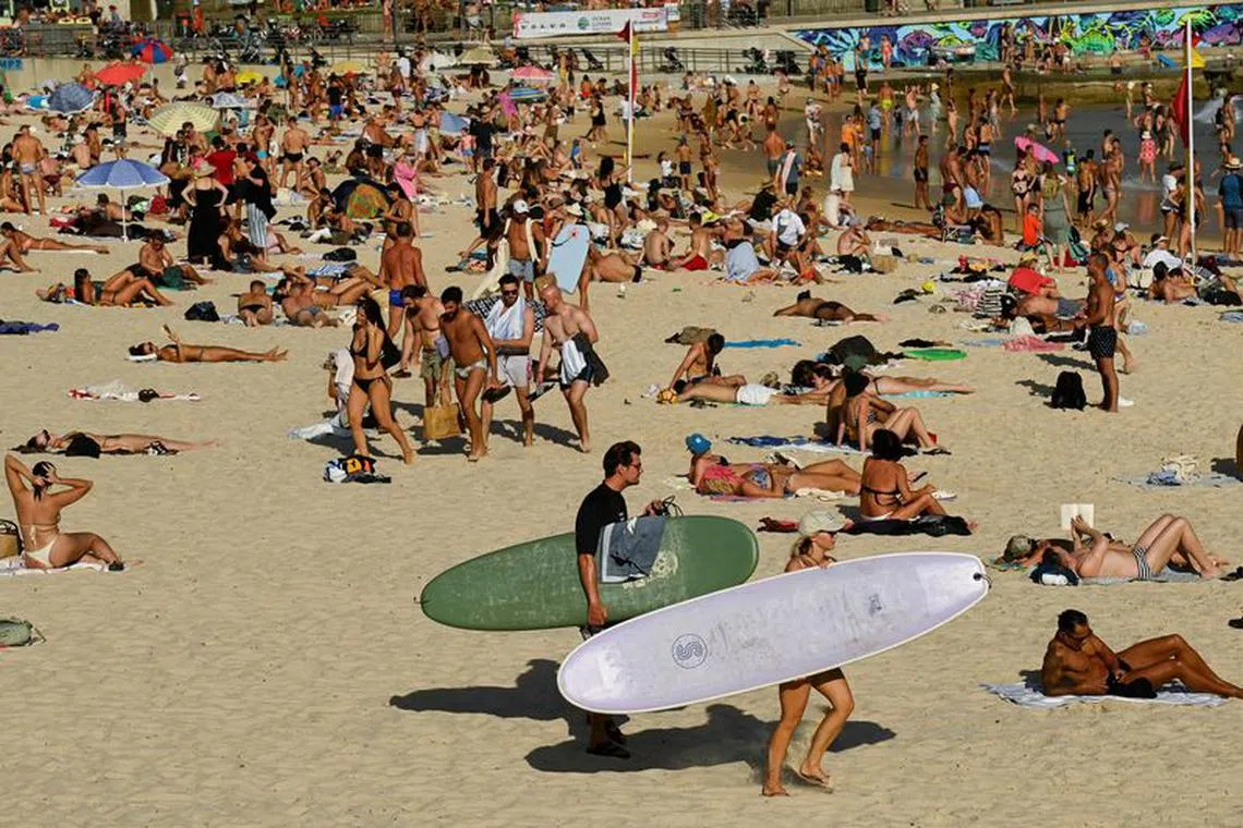 FILE PHOTO: Crowds of people enjoy the beach as parts of Australia's east reached their hottest day in more than two years amid temperatures which rose to 40 degrees Celsius (104 degrees Fahrenheit), in Bondi Beach, Sydney, Australia, March 6, 2023. REUTERS/Jaimi Joy/File Photo