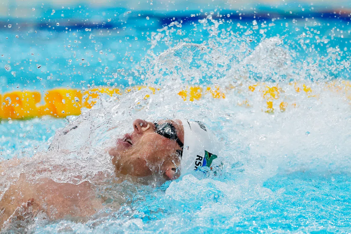 FILE PHOTO: Commonwealth Games 2026 - Swimming - Tollcross International Swimming Centre, Glasgow, Scotland, Britain - July 29, 2026  South Africa's Pieter Coetze in action during the men's 100m backstroke final REUTERS/Andrew Couldridge/File Photo