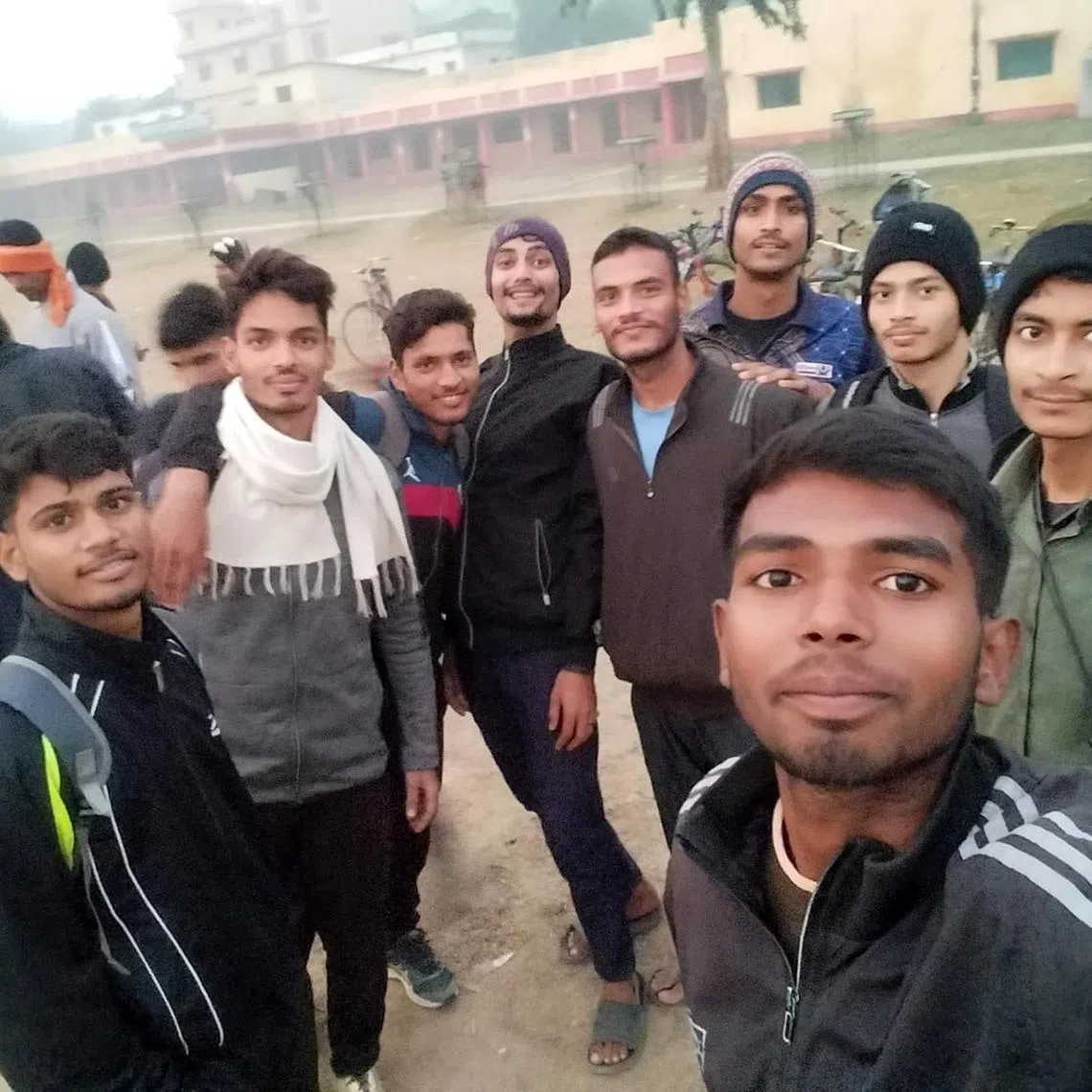 rmarmy - Farmer's son Ajay Kumar, 21, (striped jacket) from Begusarai, Bihar, exercised from 4am to 7am with hundreds of other boys in his village since he was 17 years old, all to get a permanent job in the army. After he failed the interview last year, he wishes he had done a graduation course instead. 

Photo courtesy: Ajay Kumar