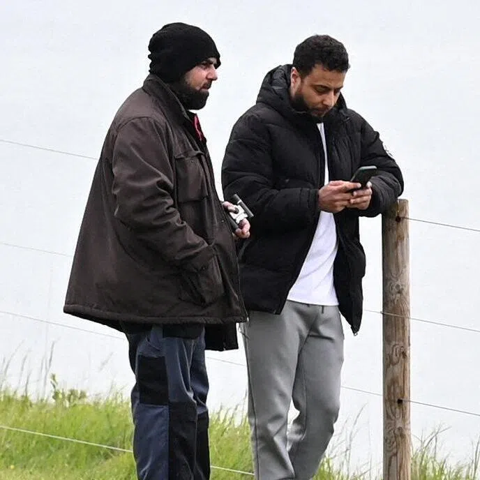 A police surveillance image shows Amar Hussein (left) and Walid Saadaoui.