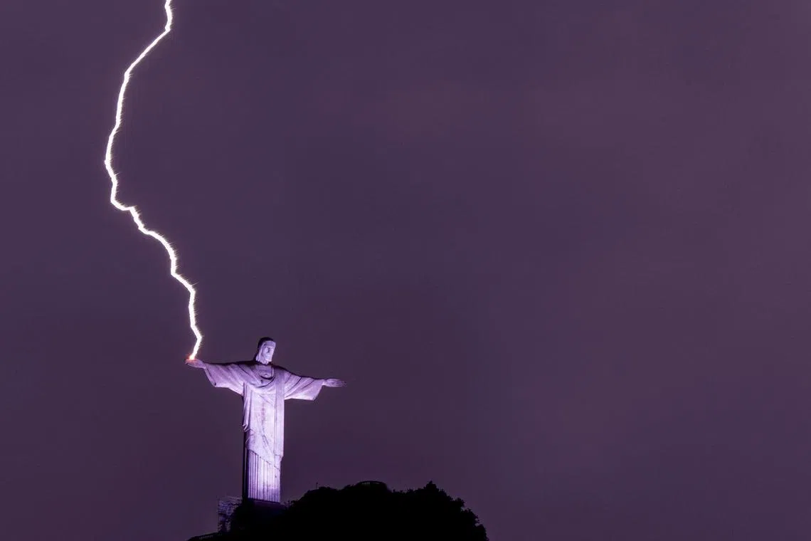A lightning hits the hand of the Christ the Redeemer statue at the Corcovado mountain in Rio de Janeiro, Brazil, on Feb 21, 2023. 