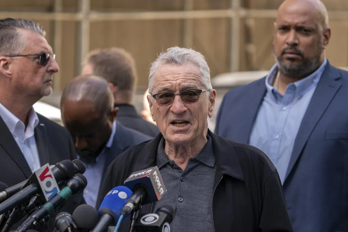 Hollywood star Robert De Niro (centre) speaking to the media on May 28, on behalf of the Biden campaign, outside the the New York courthouse where Donald Trump is standing trial.