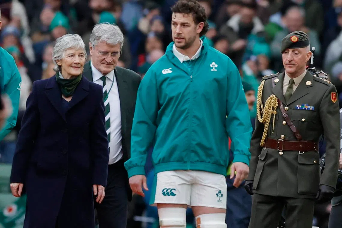 Rugby Union - Six Nations Championship - Ireland v Italy - Aviva Stadium, Dublin, Ireland - February 14, 2026 Ireland's Caelan Doris with President of Ireland Catherine Connolly and President of the Irish Rugby Football Union John O'Driscoll REUTERS/Clodagh Kilcoyne