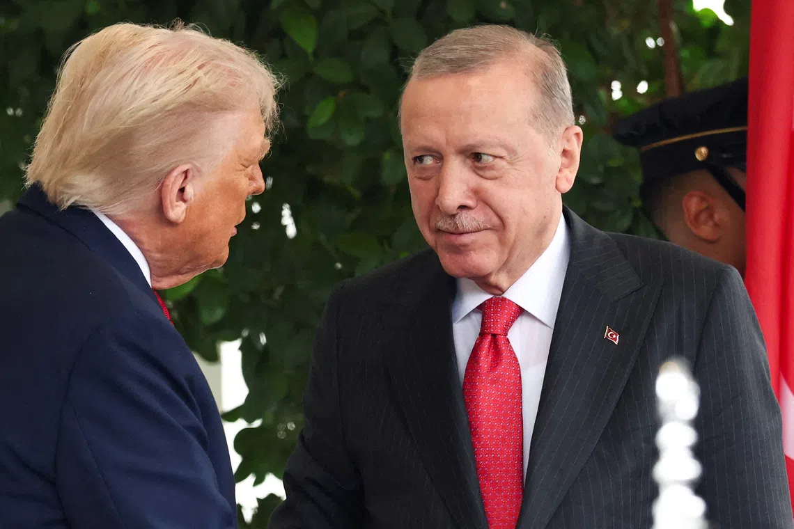 FILE PHOTO: U.S. President Donald Trump welcomes Turkey's President Recep Tayyip Erdogan at the White House in Washington, D.C., U.S., September 25, 2025. REUTERS/Kevin Lamarque/File Photo