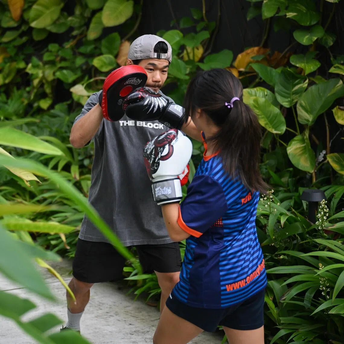 Kelly (not her real name) training with her coach Allan Ng at the Foundry on May 29.