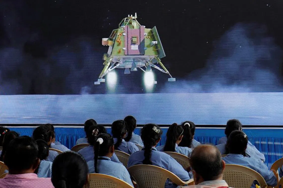 People watch a live stream of Chandrayaan-3 spacecraft's landing on the moon, inside an auditorium of Gujarat Science City in Ahmedabad, India, August 23, 2023. REUTERS/Amit Dave