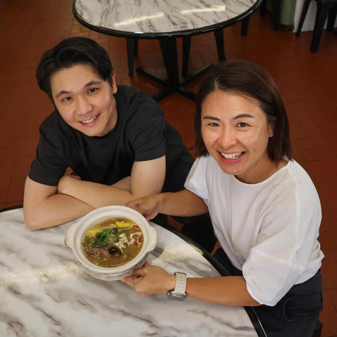 Allan Tan (left), 35, and his sister Vivian Tan, 49 are the third generation owners of Tan Ser Seng Herbal Soup in Geylang.