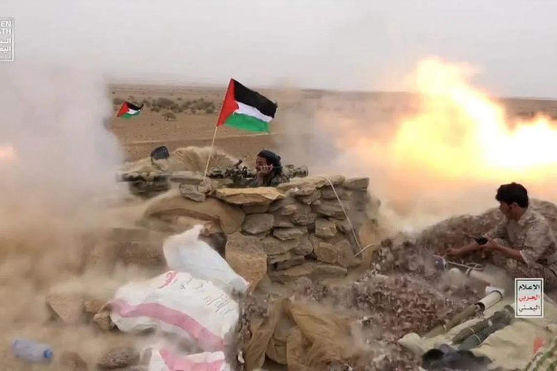 Houthi fighters fire anti-tank grenades during a military manoeuvre near Sanaa, Yemen, October 30, 2023. Houthi Media Center/Handout via