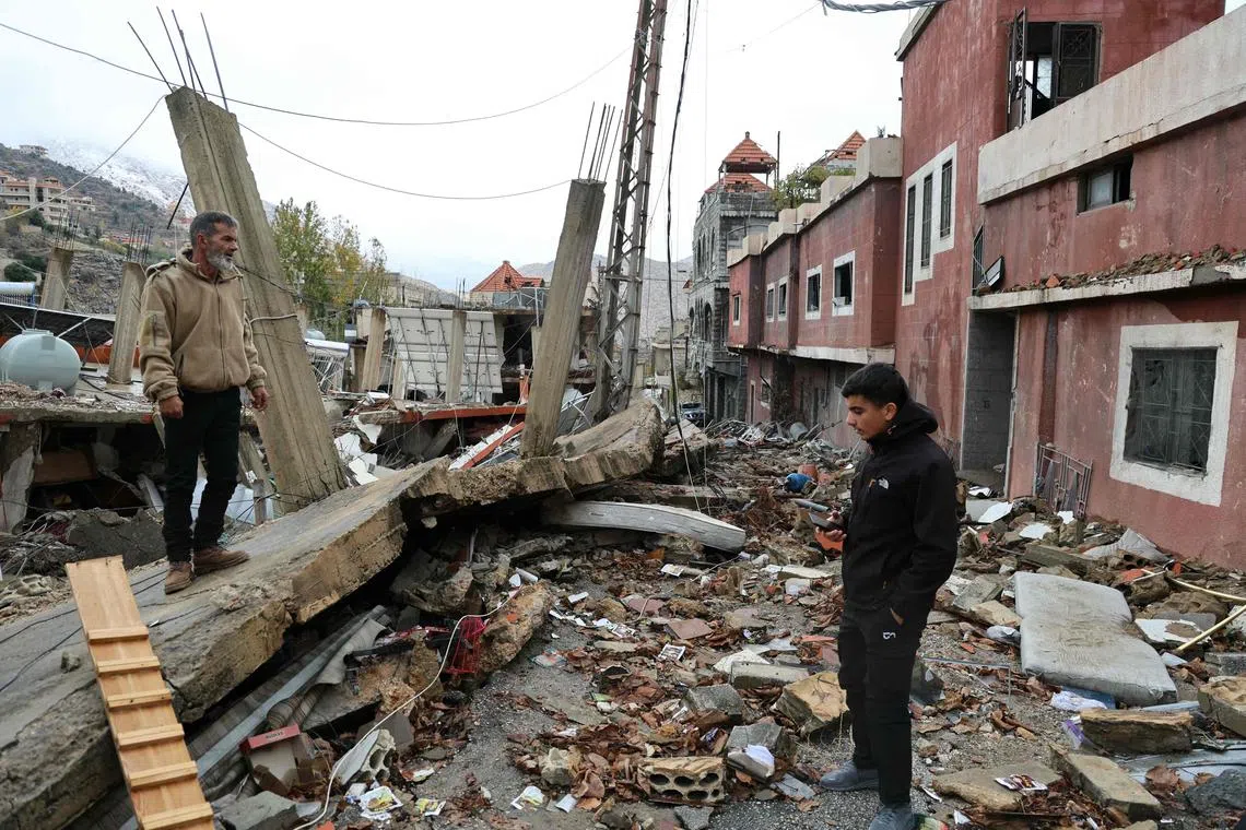 Residents who had fled the southern Lebanese border village of Shebaa, checking the damage upon their return on Nov 27, following a ceasefire between Israel and Hezbollah.