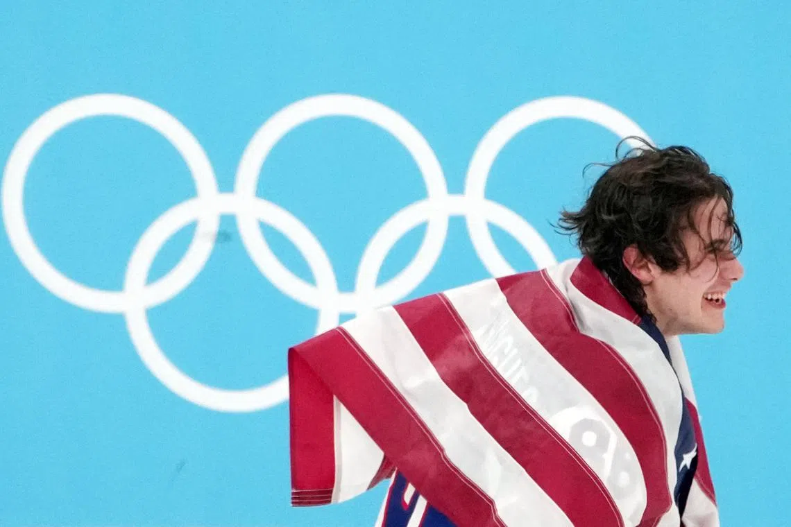 Feb 22, 2026; Milan, Italy; Jack Hughes of the United States celebrates after winning the men's ice hockey gold medal game during the Milano Cortina 2026 Olympic Winter Games at Milano Santagiulia Ice Hockey Arena. Mandatory Credit: James Lang-Imagn Images