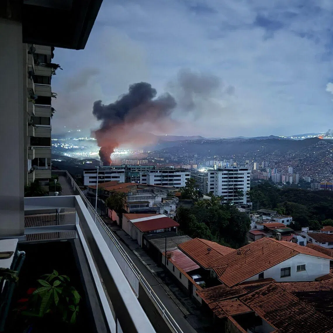 Smoke billowing over Caracas after a series of explosions during a US military operation that led to the capture of Venezuelan President Nicolas Madruo on Jan 3.