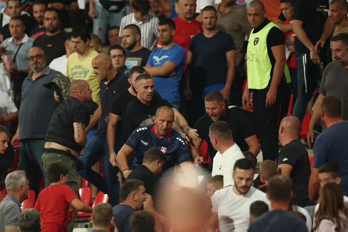 Soccer Football - World Cup - UEFA Qualifiers - Group K - Serbia v England - Stadion Rajko Mitic, Belgrade, Serbia - September 9, 2025 Serbia fans clash in the stands REUTERS/Marko Djurica