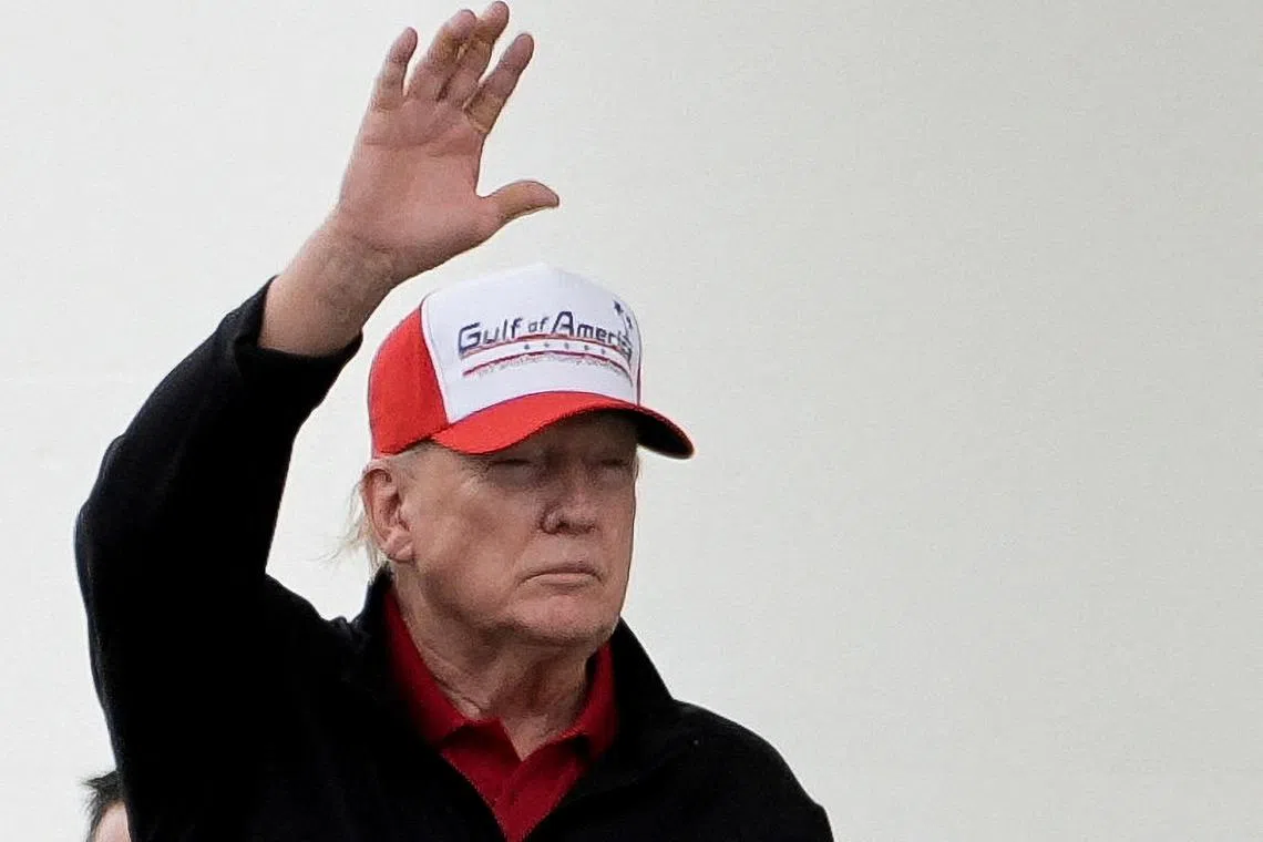 FILE PHOTO: U.S. President Donald Trump gestures while wearing a hat that reads \"Gulf of America\", as he departs the White House, in Washington, D.C., U.S., April 20, 2025. REUTERS/Ken Cedeno/File Photo