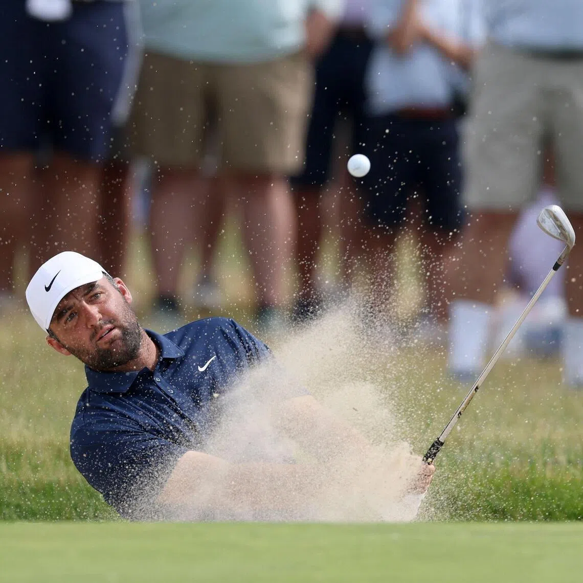 Scottie Scheffler of the United States plays a shot from the bunker on the 13th hole during the second round of the 126th U.S. OPEN at Shinnecock Hills Golf Club.