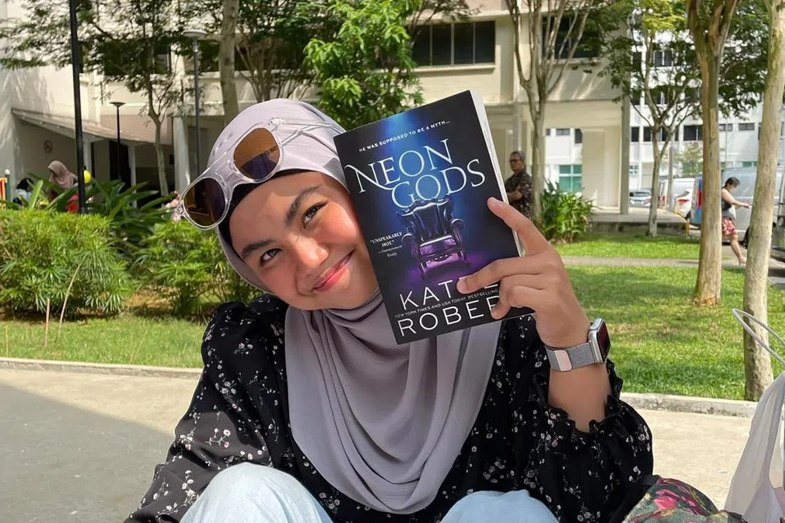 Nurse and BookToker Fatin Fathiah Aidil makes time to read during breaks, while commuting, before work, during meals and before bed.