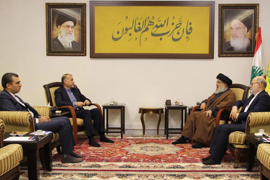 A handout photo made available by the Hezbollah Media Relations Office shows Hezbollah leader Sayyed Hassan Nasrallah (second from right) meeting Iranian Foreign Minister Hossein Amir Abdollahian (second from left) in Beirut.