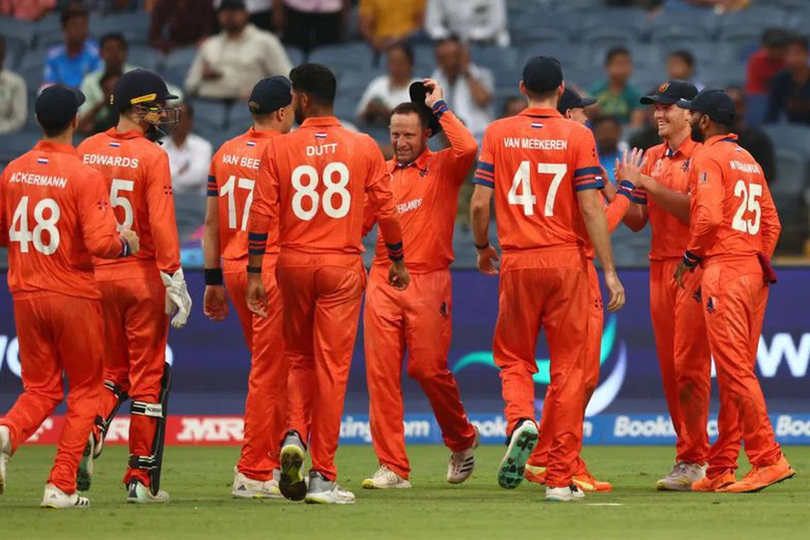 Cricket - ICC Cricket World Cup 2023 - England v Netherlands - Maharashtra Cricket Association Stadium, Pune, India - November 8, 2023 Netherlands' Aryan Dutt celebrates with teammates after taking the wicket of England's Moeen Ali, caught out by Bas de Leede REUTERS/Andrew Boyers/ File Photo