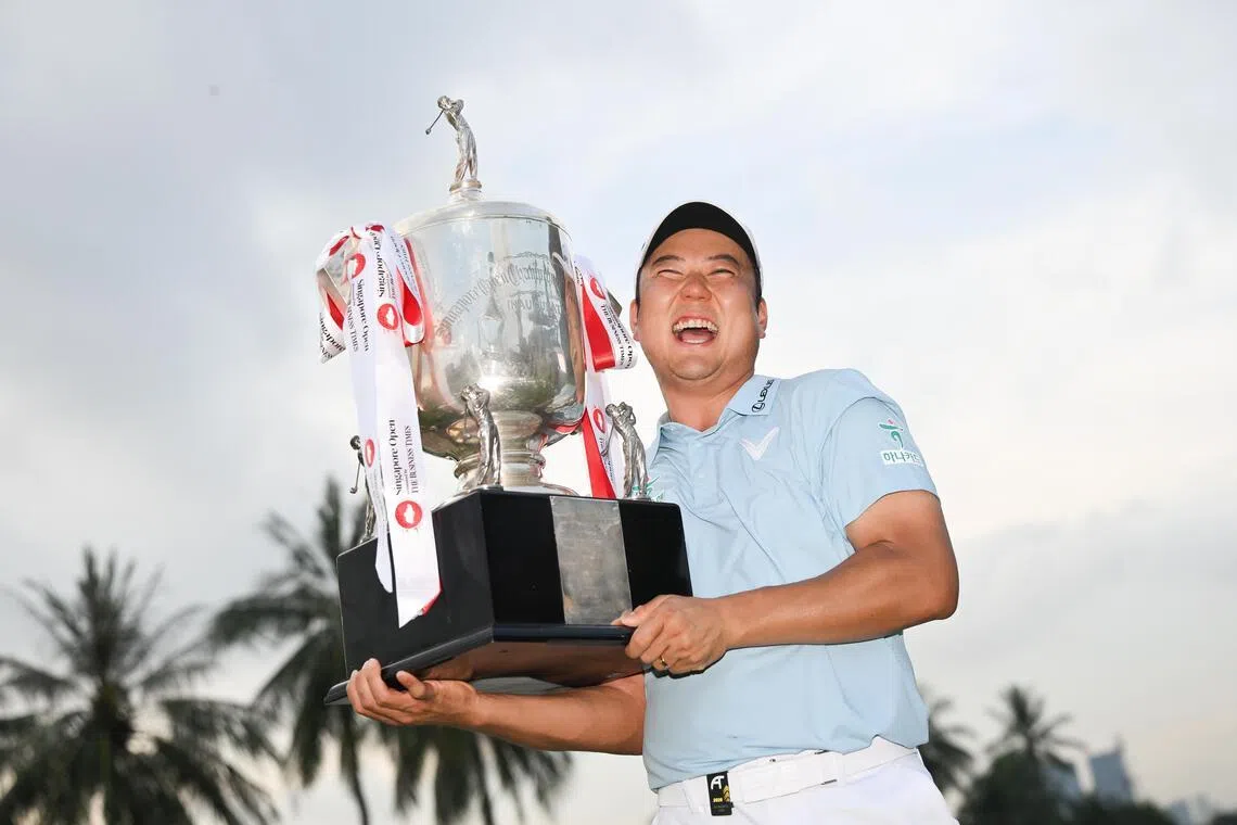 Jeongwoo Ham from South Korea with his trophy after winning the Singapore Open presented by The Business Times at Sentosa Golf Club’s Serapong Course on April 26, 2026. 