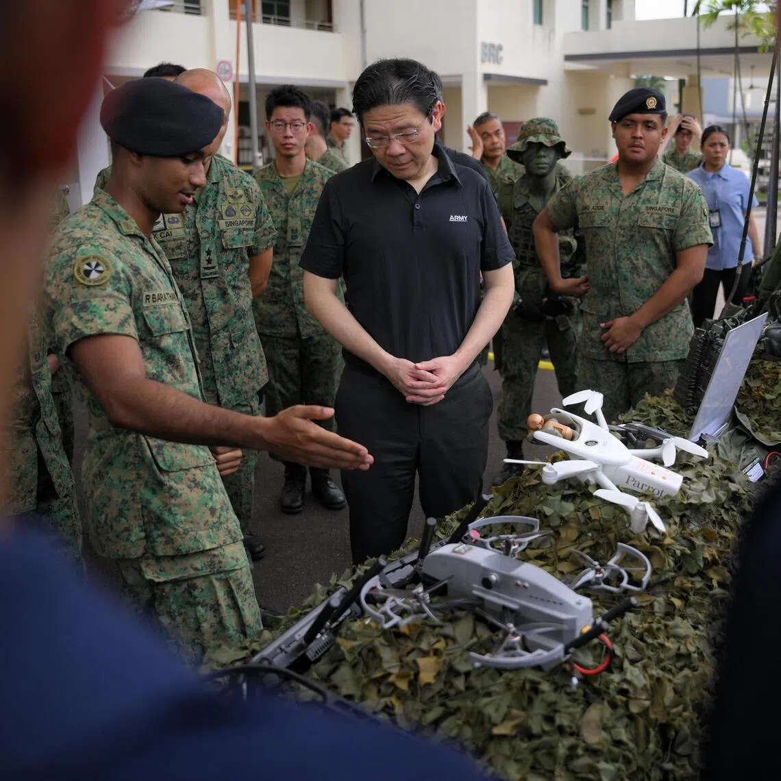 Prime Minister Lawrence Wong on a tour of the static drone display during his visit to Mandai Hill Camp on April 9.