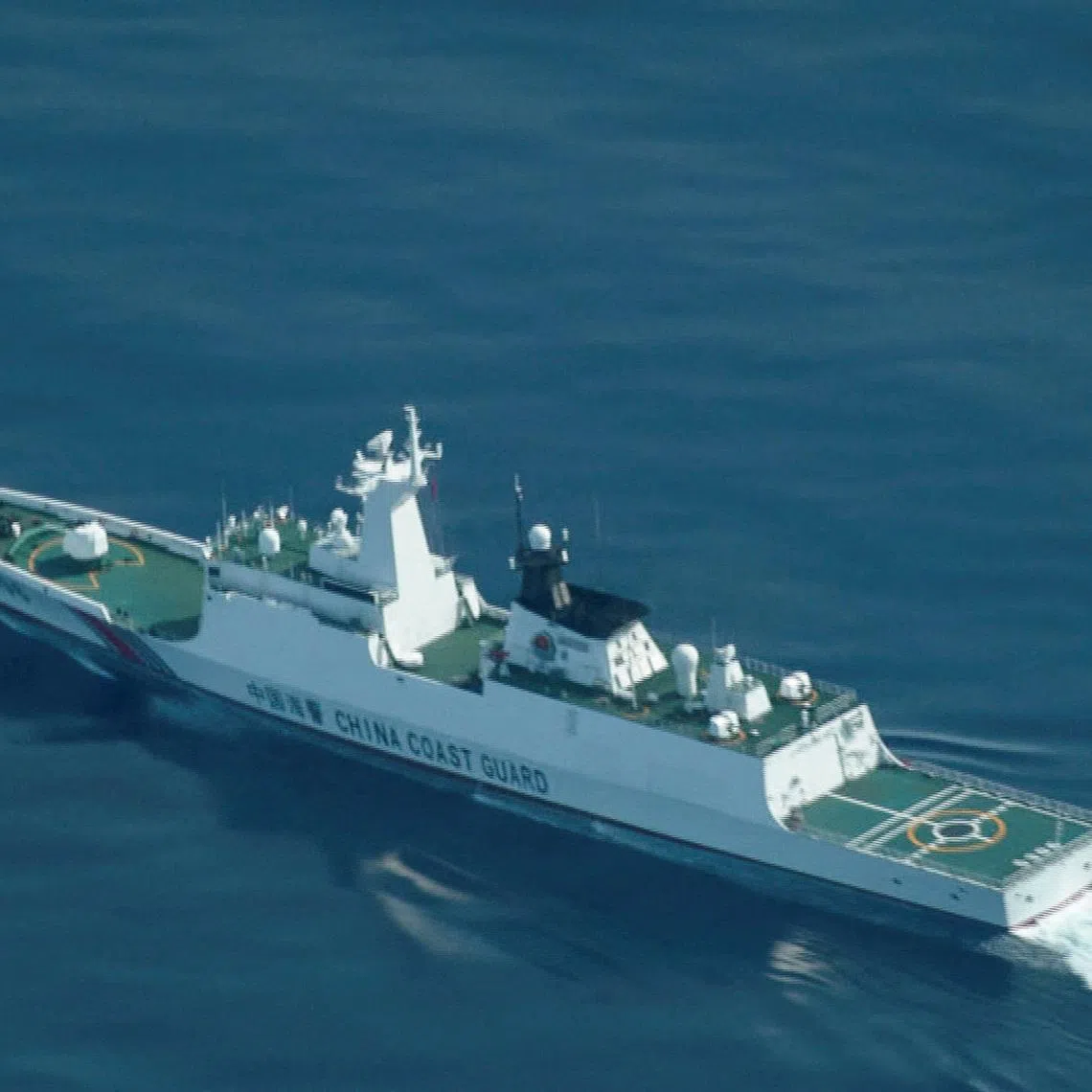 FILE PHOTO: An aerial view of a China Coast Guard ship navigating near the disputed Scarborough Shoal, as Philippine Coast Guard aircraft carrying journalists patrols the area, days after two Chinese vessels collided in the area while allegedly trying to block a Philippine supply mission, in the South China Sea, August 13, 2025. REUTERS/Adrian Portugal/File Photo