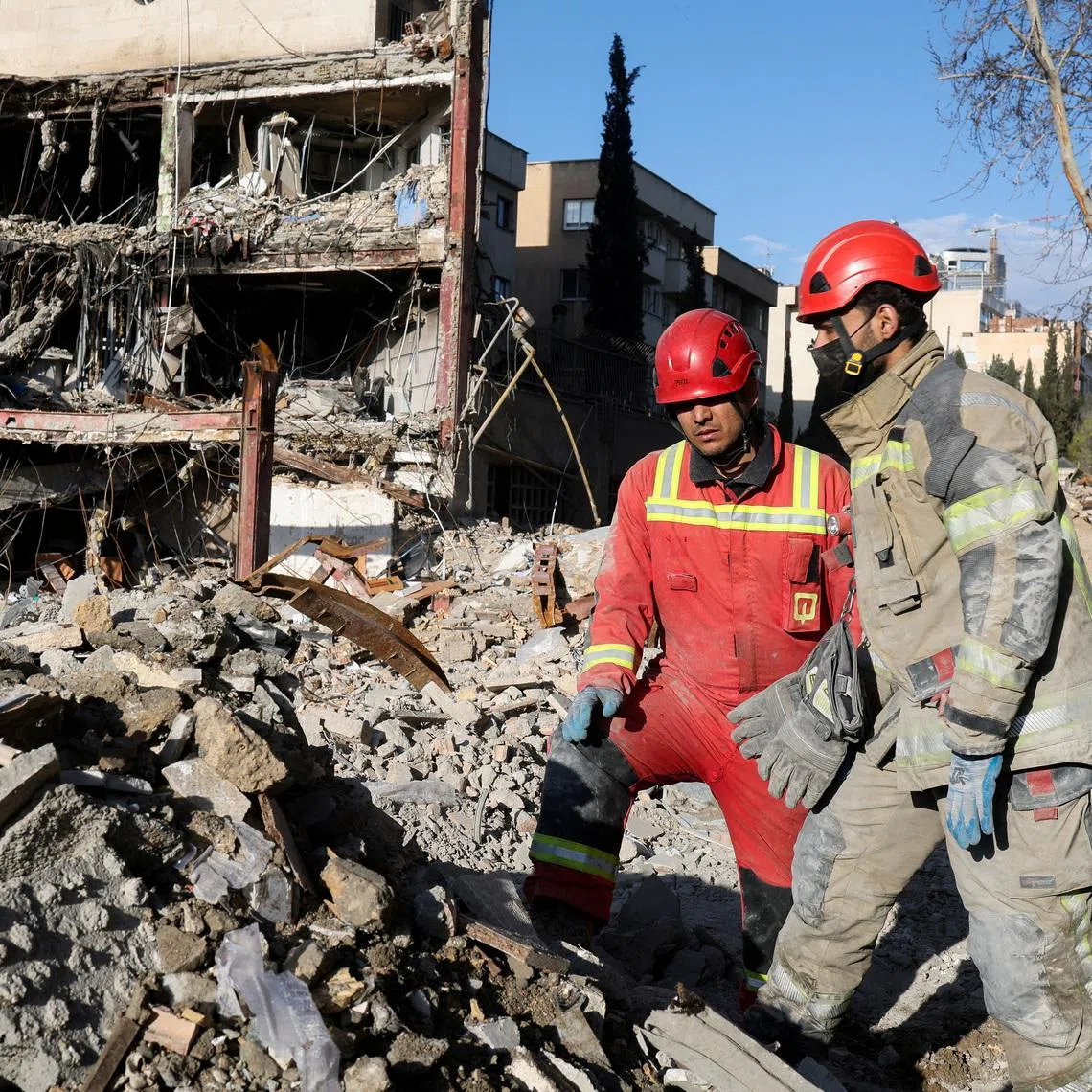 Members of a Red Crescent rescue team work at a building that was damaged by a strike, amid the U.S.-Israeli conflict with Iran, in Tehran, Iran, March 21, 2026. Reuters/Alaa Al-Marjani