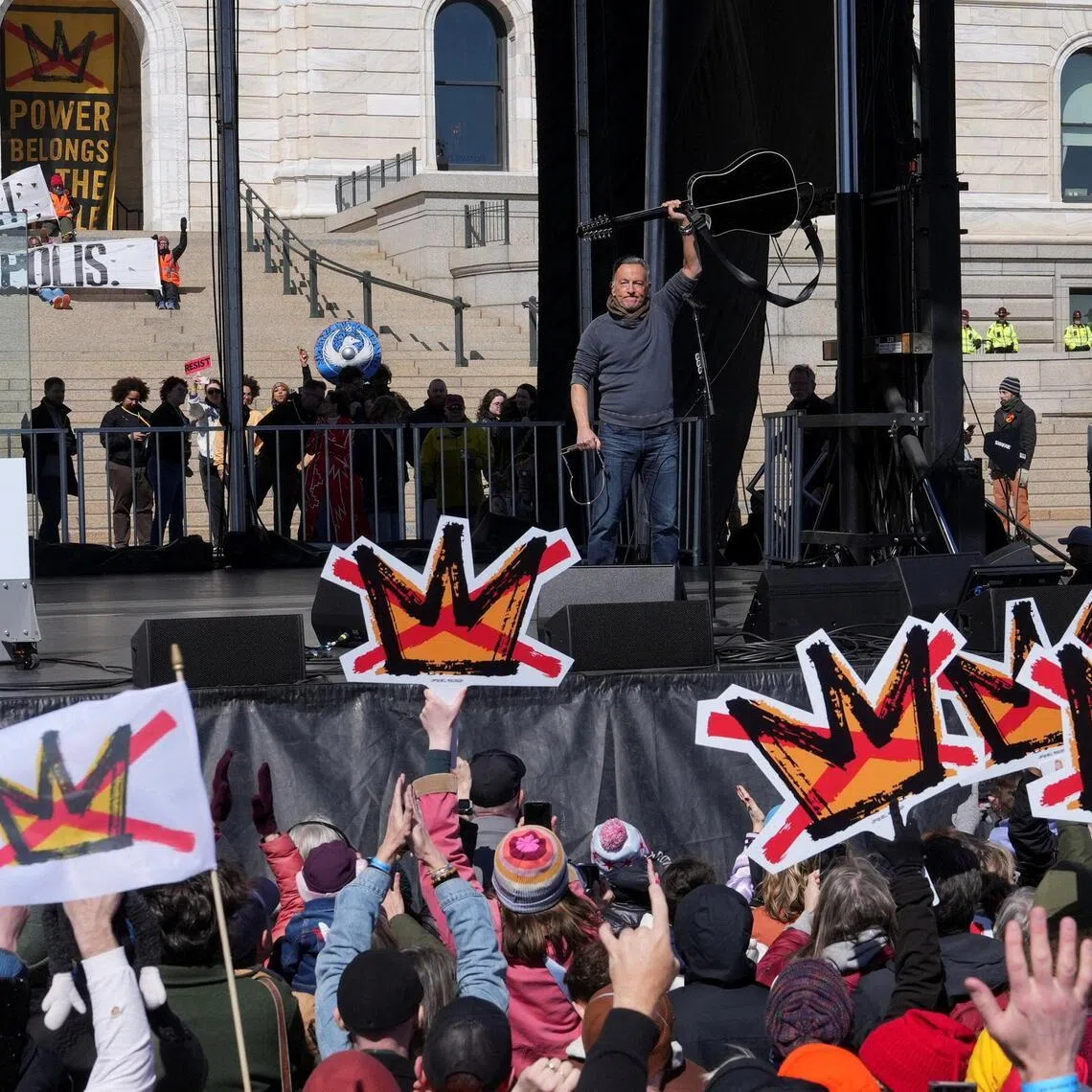 Bruce Springsteen raises his guitar during a “No Kings” protest against US President Donald Trump in St Paul, Minnesota.
