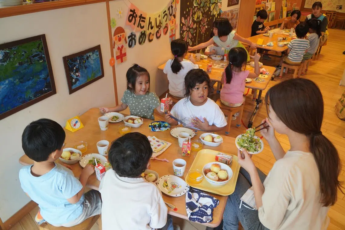 Three-to-five-year-olds during lunchtime at Sakurashinmachi Nursery School in Tokyo.