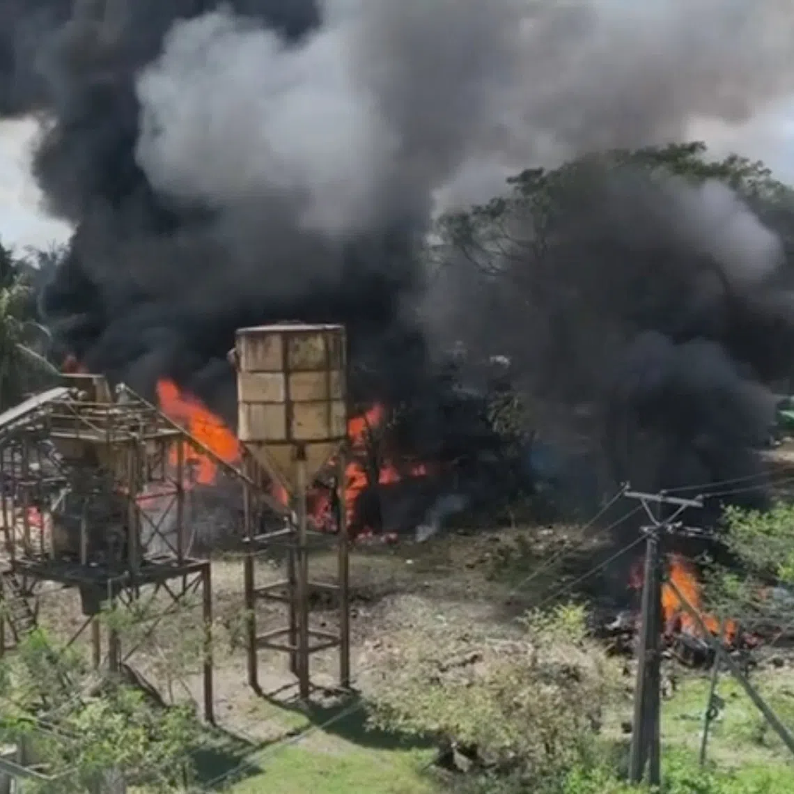 A screengrab from a social media video showing smoke rising after an airstrike by the Myanmar military on Sept 28, in Kyauktaw, Rakhine State, according to rebel fighters.