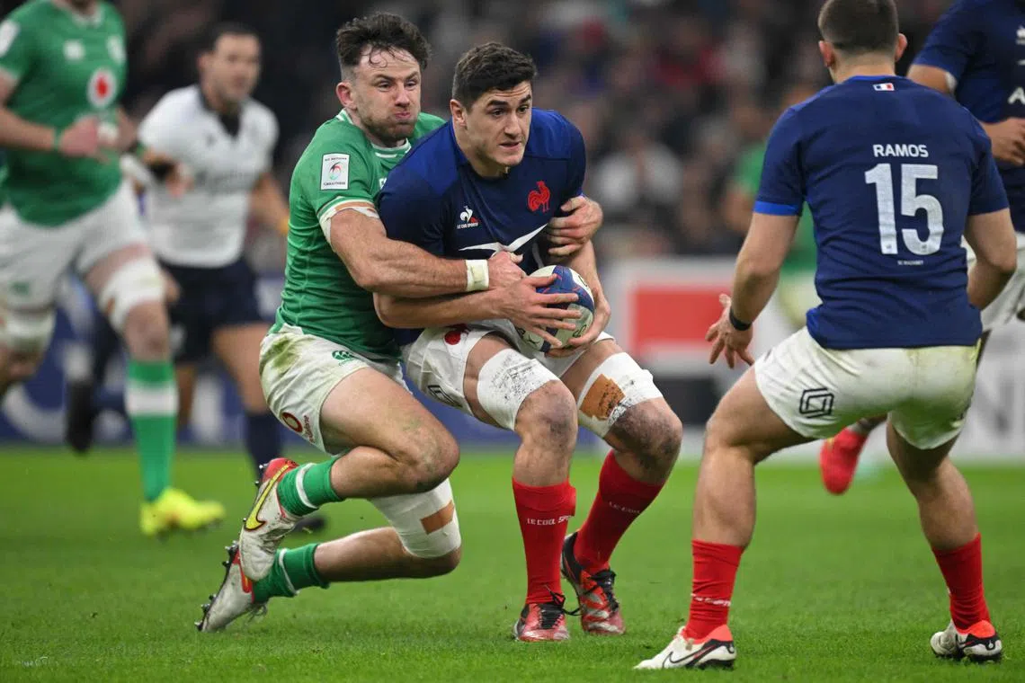 France flanker Paul Boudehent is tackled by Ireland full-back Hugo Keenan during the Six Nations match at the Stade Velodrome in Marseille.